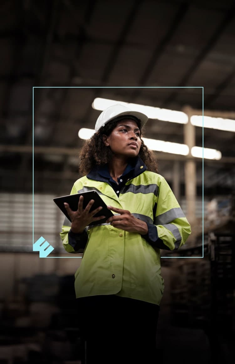 woman using a tablet in a warehouse or factory