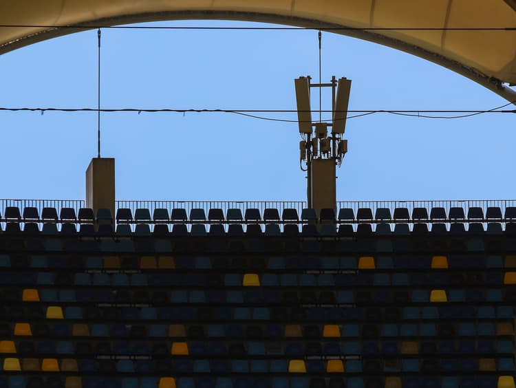 Cellular antenna over stadium seating illustrating DAS and campus wireless network solutions